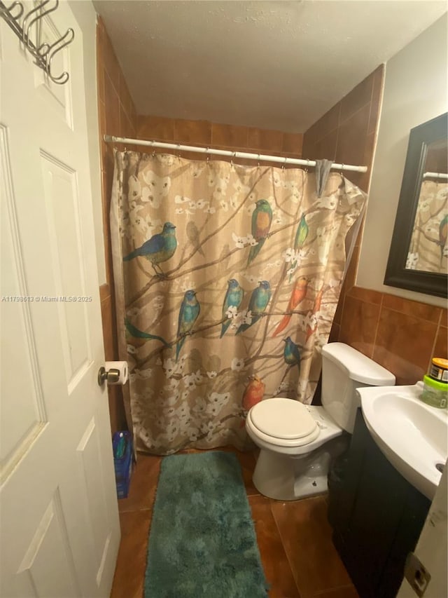 8130 SW 7th Ct, North Lauderdale, FL 33068 - bathroom featuring tile walls, toilet, vanity, and a shower with curtain