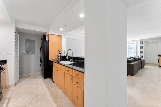 6917 Collins Ave Unit 607, Miami Beach, FL 33141 - kitchen with a sink, recessed lighting, black appliances, baseboards, and open floor plan