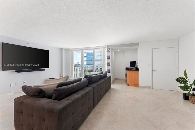 6917 Collins Ave Unit 607, Miami Beach, FL 33141 - living area with a textured ceiling