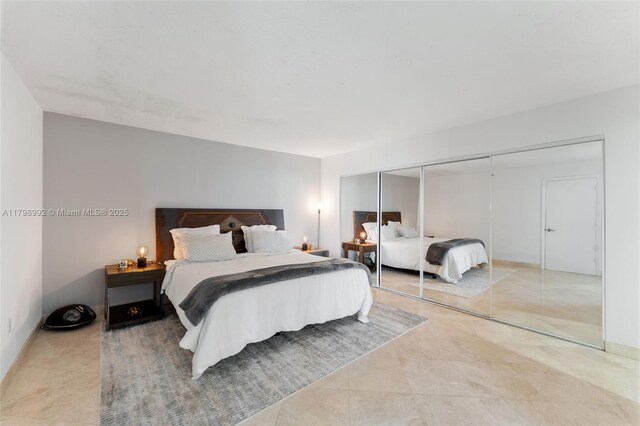 6917 Collins Ave Unit 607, Miami Beach, FL 33141 - tiled bedroom featuring a closet