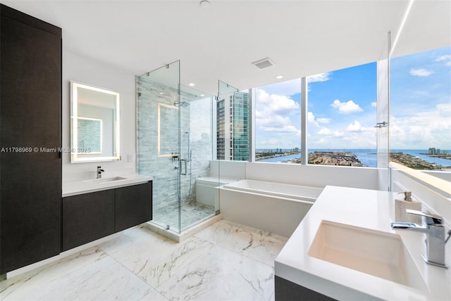 851 NE 1st Ave Unit 4011, Miami, FL 33132 - full bathroom with two vanities, a bath, a shower stall, and a water view