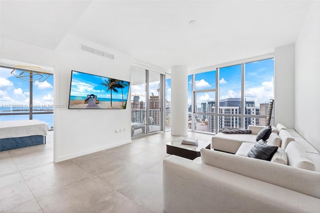 851 NE 1st Ave Unit 4011, Miami, FL 33132 - tiled living room with expansive windows, baseboards, and a chandelier