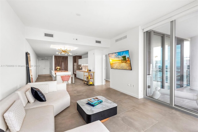 851 NE 1st Ave Unit 4011, Miami, FL 33132 - living area featuring a chandelier, baseboards, and light tile patterned flooring