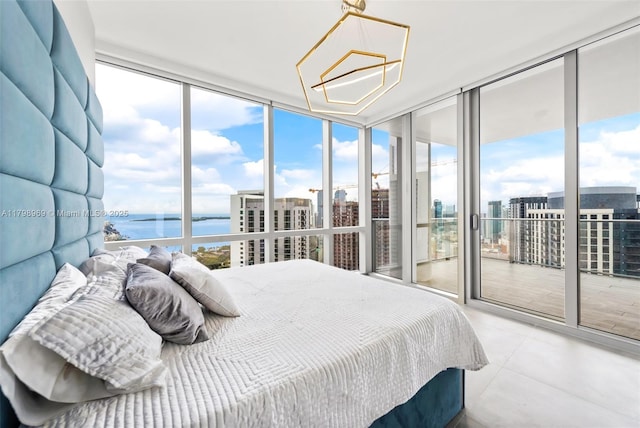 851 NE 1st Ave Unit 4011, Miami, FL 33132 - bedroom featuring a water view, access to outside, floor to ceiling windows, multiple windows, and a city view