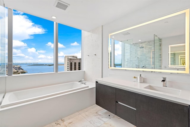 851 NE 1st Ave Unit 4011, Miami, FL 33132 - bathroom with a bath, a water view, vanity, marble finish floors, and a stall shower