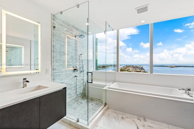 851 NE 1st Ave Unit 4011, Miami, FL 33132 - bathroom with a garden tub, a stall shower, vanity, a water view, and marble look tile flooring