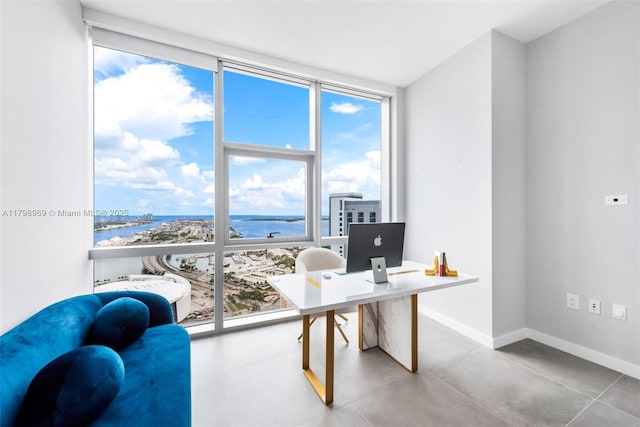 851 NE 1st Ave Unit 4011, Miami, FL 33132 - office area with floor to ceiling windows, plenty of natural light, baseboards, and concrete flooring