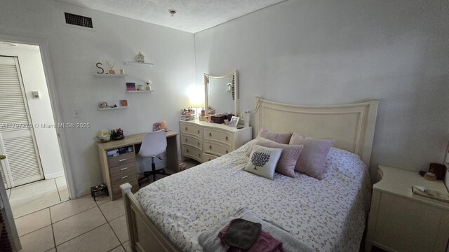 6425 SW 130th Pl Unit 704, Miami, FL 33183 - bedroom with light tile patterned floors
