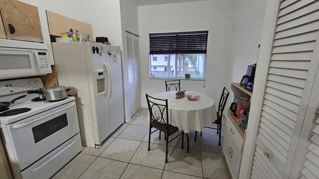 6425 SW 130th Pl Unit 704, Miami, FL 33183 - kitchen featuring white appliances and light tile patterned floors