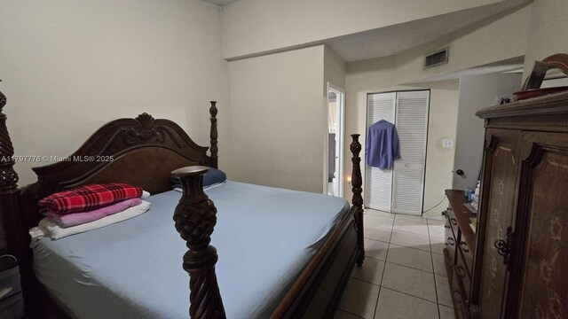 6425 SW 130th Pl Unit 704, Miami, FL 33183 - bedroom with light tile patterned floors