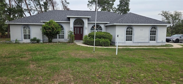 4725 SW 103rd Pl, Ocala, FL 34476 - single story home featuring a shingled roof, a front lawn, and stucco siding