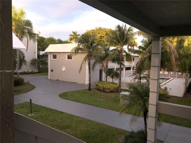 view of community featuring fence