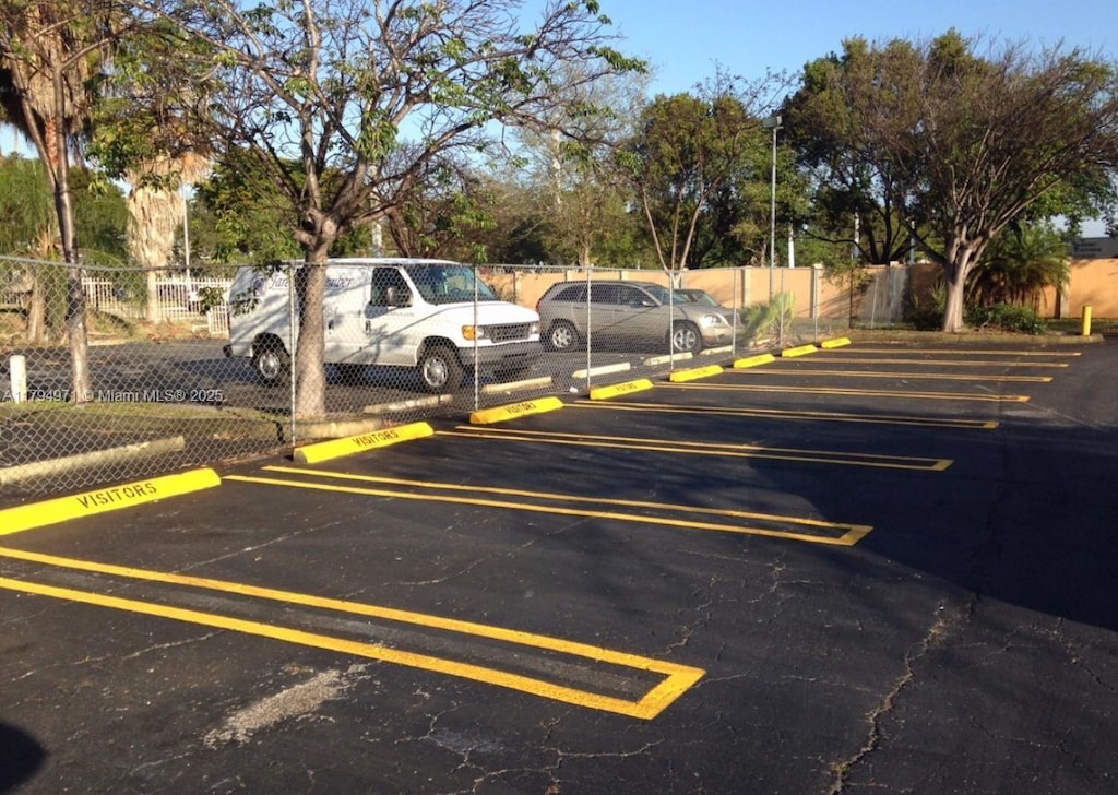 uncovered parking lot with fence