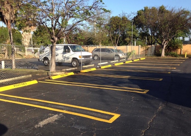 uncovered parking lot with fence