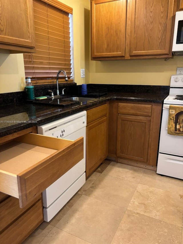 9420 Sunrise Lakes Blvd Unit 106, Sunrise, FL 33322 - kitchen with white appliances, brown cabinetry, and dark stone countertops