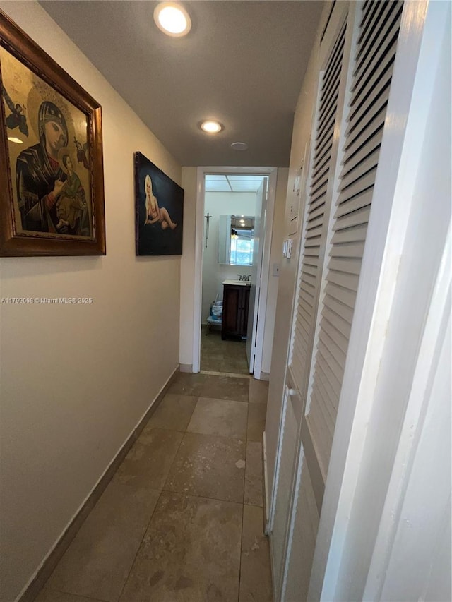 9420 Sunrise Lakes Blvd Unit 106, Sunrise, FL 33322 - corridor with baseboards and recessed lighting