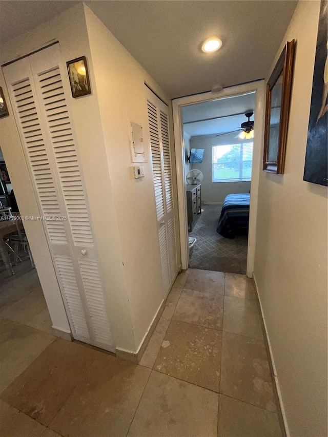 9420 Sunrise Lakes Blvd Unit 106, Sunrise, FL 33322 - hallway with baseboards and tile patterned floors