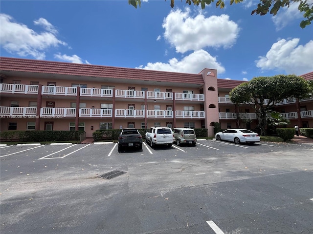 9420 Sunrise Lakes Blvd Unit 106, Sunrise, FL 33322 - view of apartment building / complex featuring uncovered parking