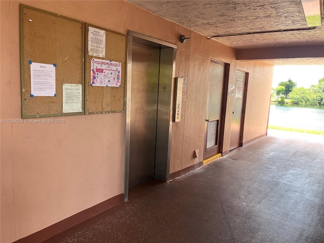 9420 Sunrise Lakes Blvd Unit 106, Sunrise, FL 33322 - corridor with elevator and a water view