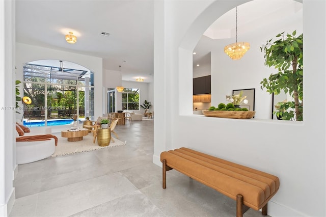 10275 Oak Meadow Ln, Lake Worth, FL 33449 - corridor with a sunroom and arched walkways