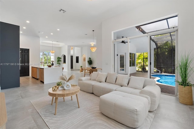 10275 Oak Meadow Ln, Lake Worth, FL 33449 - living area featuring recessed lighting, arched walkways, and a high ceiling