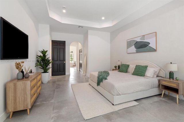 10275 Oak Meadow Ln, Lake Worth, FL 33449 - bedroom with arched walkways, a raised ceiling, concrete floors, and recessed lighting