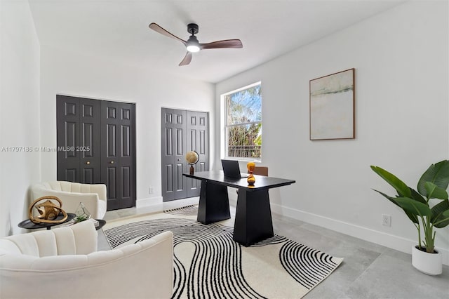 10275 Oak Meadow Ln, Lake Worth, FL 33449 - office space featuring baseboards, a ceiling fan, and concrete floors