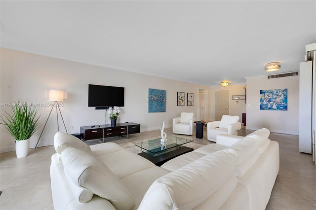 9801 Collins Ave Unit 5S, Bal Harbour, FL 33154 - living room with light tile patterned floors and baseboards