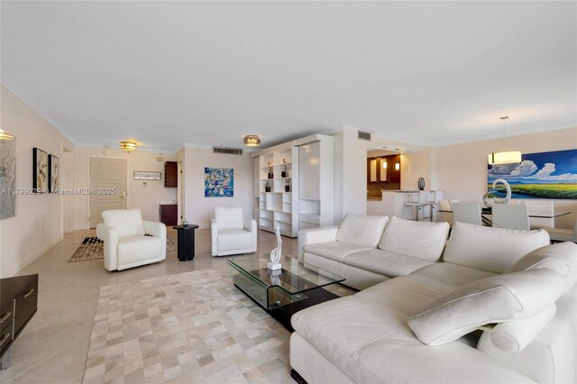 9801 Collins Ave Unit 5S, Bal Harbour, FL 33154 - living area with ornamental molding and light tile patterned flooring