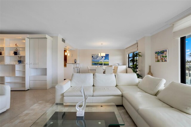 9801 Collins Ave Unit 5S, Bal Harbour, FL 33154 - living room featuring healthy amount of natural light, crown molding, and light tile patterned floors