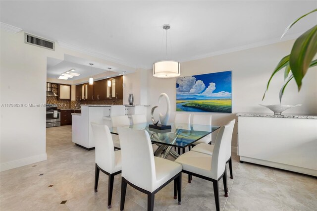 9801 Collins Ave Unit 5S, Bal Harbour, FL 33154 - dining area featuring ornamental molding