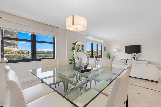 9801 Collins Ave Unit 5S, Bal Harbour, FL 33154 - dining room featuring light tile patterned flooring and baseboards