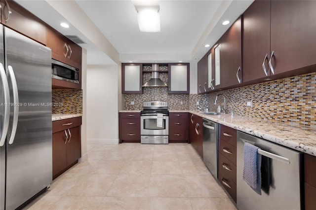9801 Collins Ave Unit 5S, Bal Harbour, FL 33154 - kitchen with stainless steel appliances, a sink, wall chimney range hood, backsplash, and light tile patterned flooring