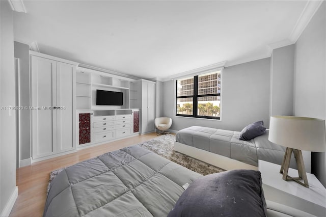 9801 Collins Ave Unit 5S, Bal Harbour, FL 33154 - bedroom featuring ornamental molding, wood finished floors, and baseboards