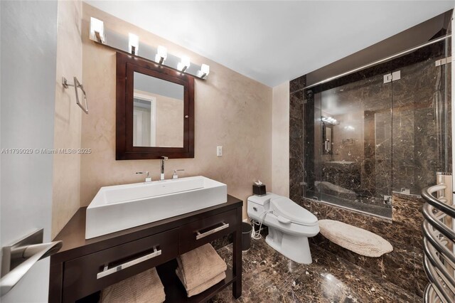 9801 Collins Ave Unit 5S, Bal Harbour, FL 33154 - bathroom with marble tiled floors, a shower stall, toilet, and vanity
