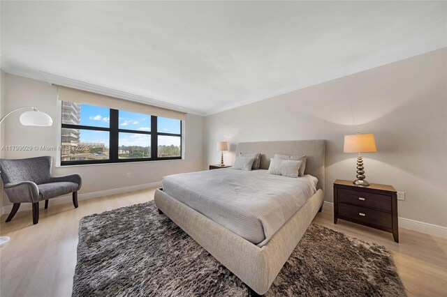 9801 Collins Ave Unit 5S, Bal Harbour, FL 33154 - bedroom featuring light wood-style flooring and baseboards