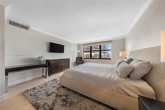 9801 Collins Ave Unit 5S, Bal Harbour, FL 33154 - bedroom featuring ornamental molding, wood finished floors, and baseboards