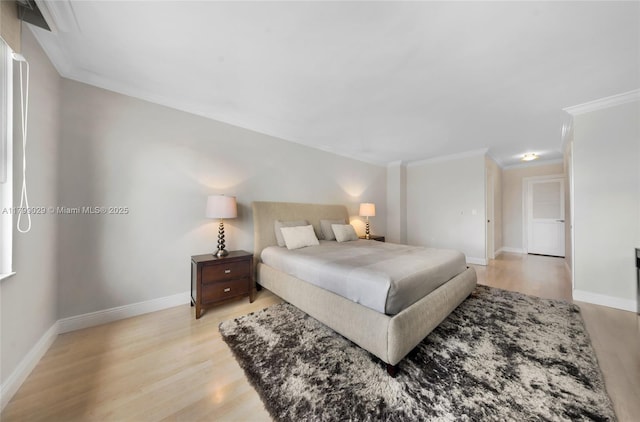 9801 Collins Ave Unit 5S, Bal Harbour, FL 33154 - bedroom with ornamental molding, light wood-style floors, and baseboards