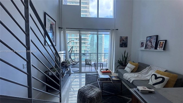 60 SW 13th St Unit 2402, Miami, FL 33130 - living room featuring a towering ceiling and stairway