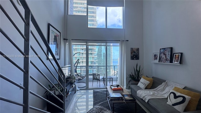 60 SW 13th St Unit 2402, Miami, FL 33130 - living area with a towering ceiling, plenty of natural light, and stairs