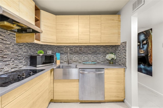 1840 Jefferson Ave Unit 103, Miami Beach, FL 33139 - kitchen featuring appliances with stainless steel finishes, custom range hood, light brown cabinetry, and decorative backsplash