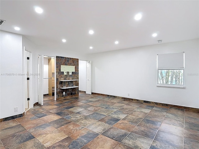 10227 SW 53rd Ct, Cooper City, FL 33328 - below grade area with baseboards, stone tile flooring, and recessed lighting