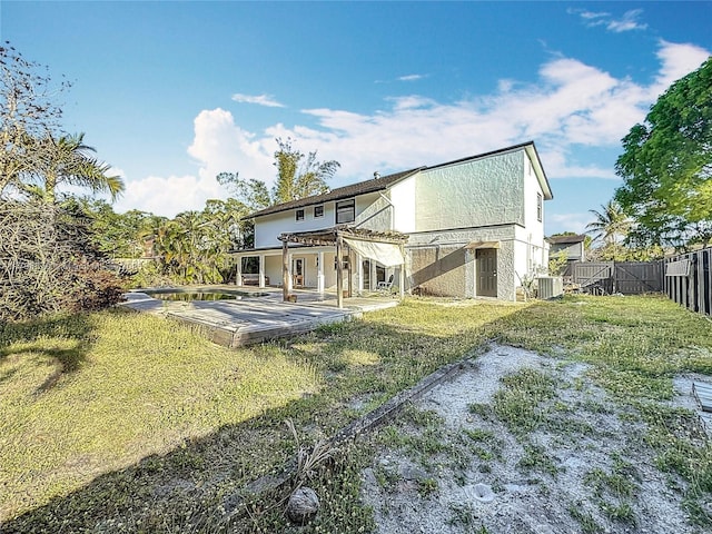 10227 SW 53rd Ct, Cooper City, FL 33328 - back of house featuring cooling unit and a deck