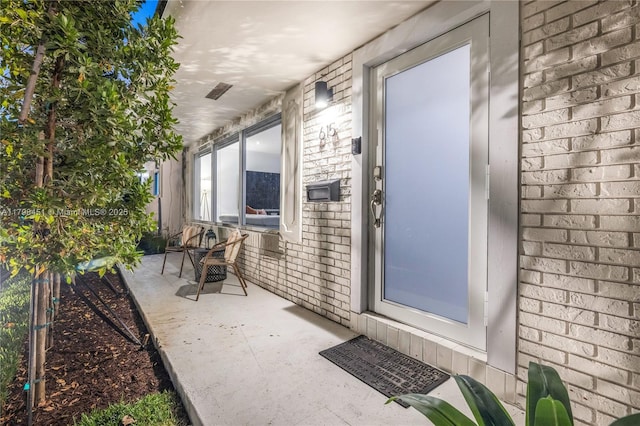 615 NE 115th St, Biscayne Park, FL 33161 - view of exterior entry with brick siding