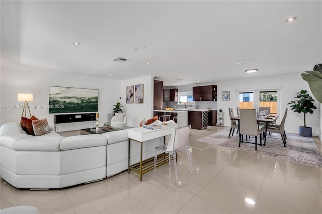 615 NE 115th St, Biscayne Park, FL 33161 - living area with light tile patterned floors and recessed lighting