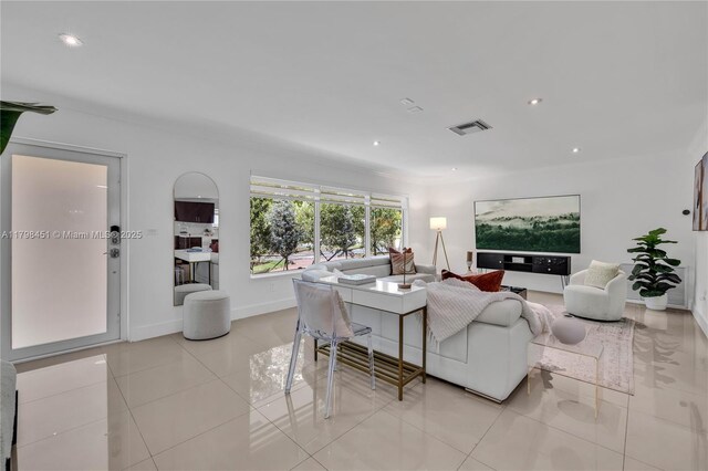 615 NE 115th St, Biscayne Park, FL 33161 - living area with light tile patterned floors, recessed lighting, and baseboards