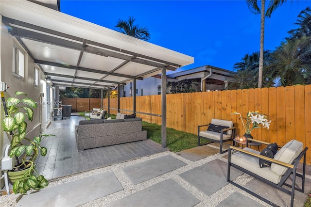 615 NE 115th St, Biscayne Park, FL 33161 - view of patio featuring a fenced backyard and outdoor lounge area
