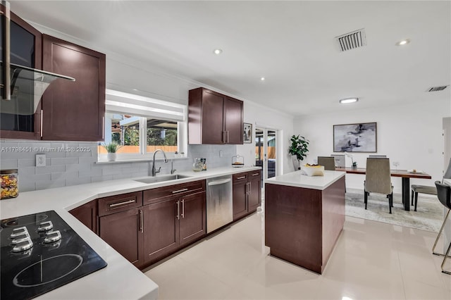 615 NE 115th St, Biscayne Park, FL 33161 - kitchen featuring a sink, dishwasher, black electric cooktop, backsplash, and a center island
