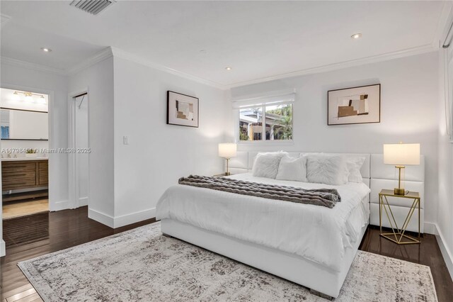 615 NE 115th St, Biscayne Park, FL 33161 - bedroom featuring baseboards, wood finished floors, crown molding, recessed lighting, and ensuite bath