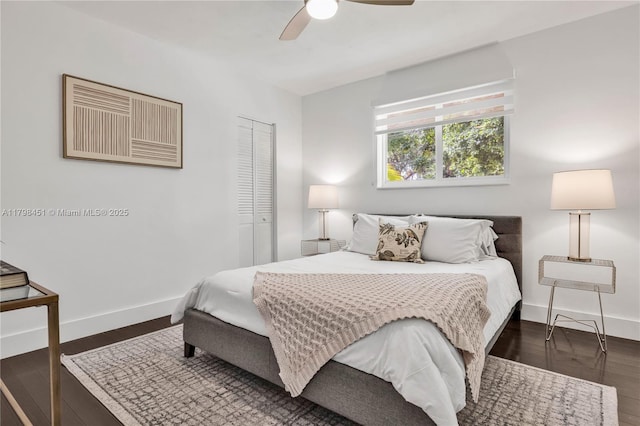 615 NE 115th St, Biscayne Park, FL 33161 - bedroom featuring a closet, baseboards, wood finished floors, and ceiling fan
